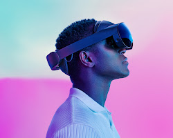 person wearing a VR headset and standing in front of a virtual city